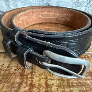 Black Leather Belt with Silver Buckle and Textured Surface